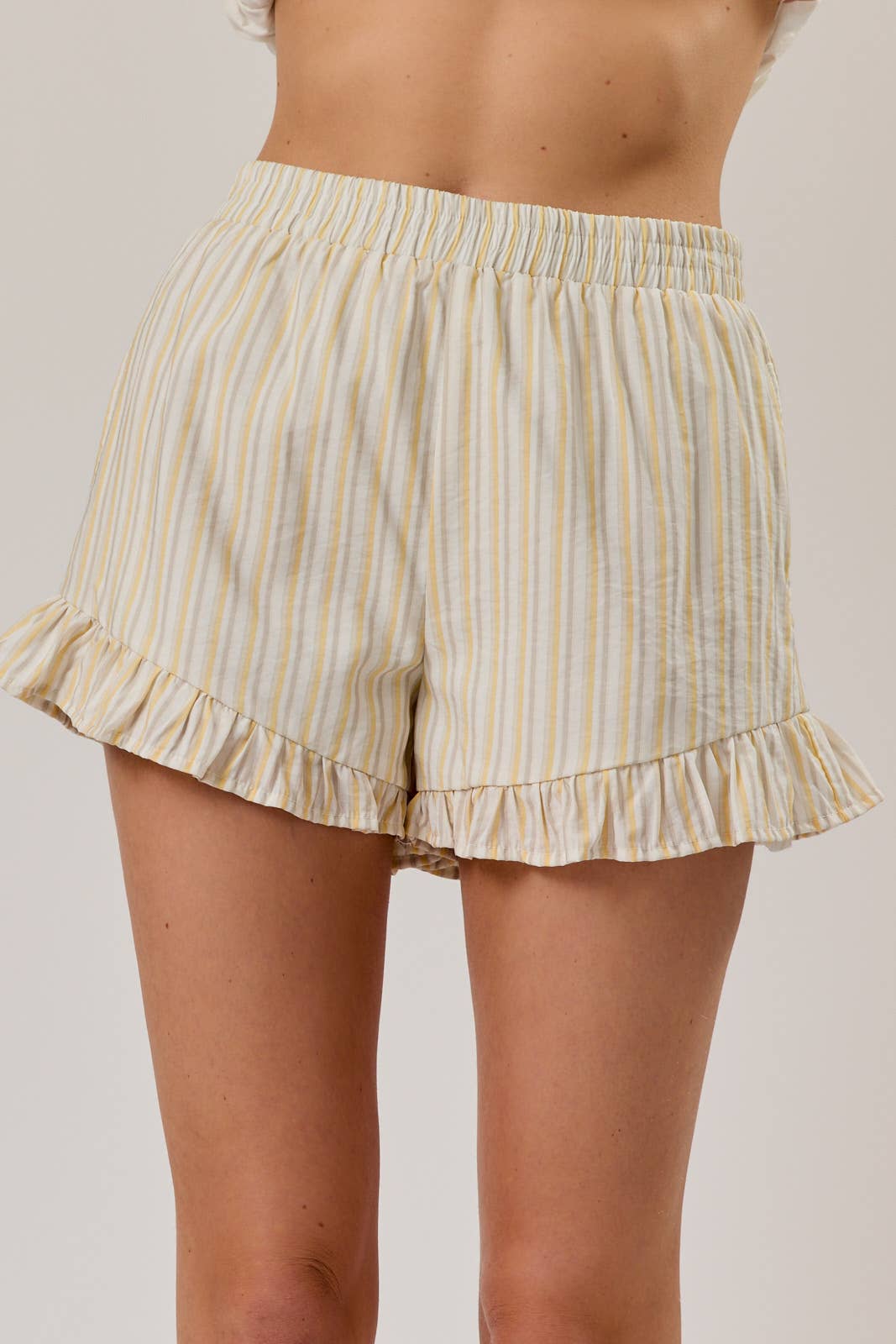 HIGH RISE STRIPE RUFFLED HEM SHORTS